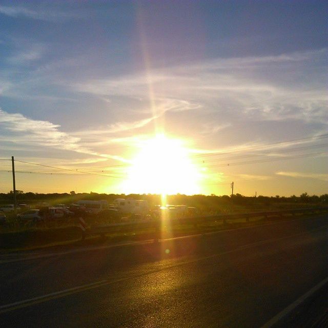 sun, sunset, sky, road, sunbeam, sunlight, landscape, transportation, lens flare, tranquil scene, tranquility, scenics, the way forward, beauty in nature, cloud - sky, nature, field, country road, cloud, idyllic