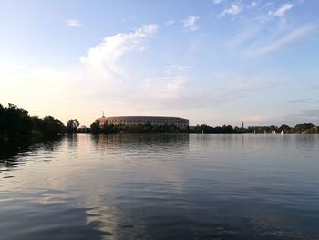 Scenic view of lake against cloudy sky