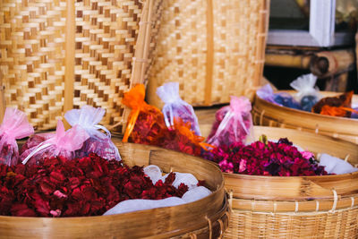 Flowers petals in wicker baskets for sale in market