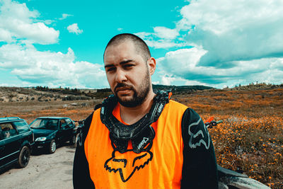 Portrait of man standing against sky