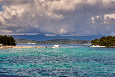 Clouds in the sky in the blue lagoon of otok krknjas veli in the mediterranean sea near croatia