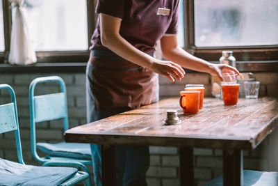 Woman standing in kitchen