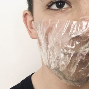 Close-up portrait of man against white background