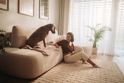 Dog sleeping on bed at home