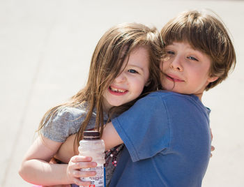 Close-up portrait of children hugging