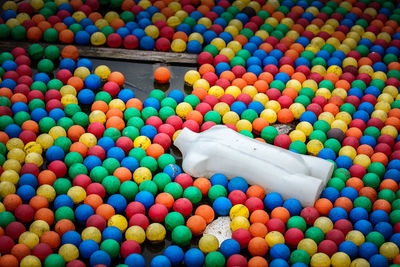 Mannequin amidst colorful balls