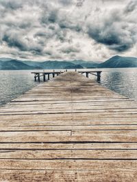 Pier over sea against sky
