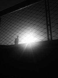 Silhouette of standing on floor against sky