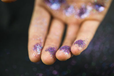 Cropped image of glittery hand