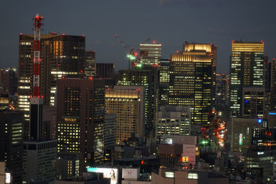 Illuminated buildings in city at night