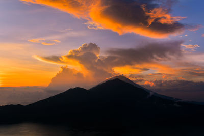 Sun is rising behind the volcano mount batur, bali, indonesia