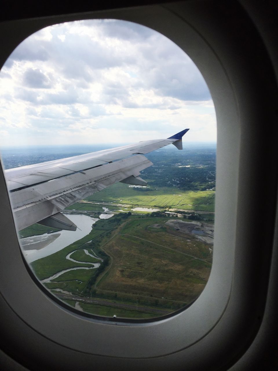 airplane, air vehicle, flying, transportation, aircraft wing, mode of transport, aerial view, sky, vehicle interior, window, mid-air, cloud - sky, part of, landscape, travel, transparent, journey, glass - material, cropped, cloud