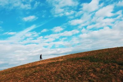 Man on landscape against sky