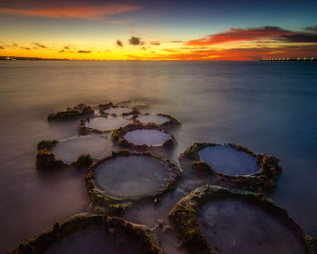 Scenic view of sea against sky during sunset