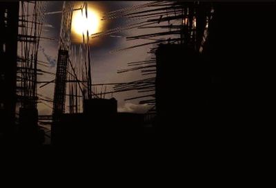Low angle view of buildings at sunset