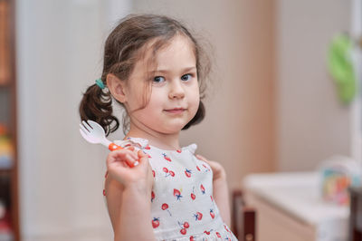 Cute girl talking while eating