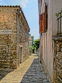 Narrow alley with buildings in background