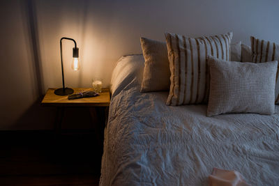 Electric lamp on bed at home