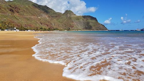 Scenic view of beach against sky