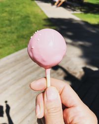 Close-up of hand holding ice cream