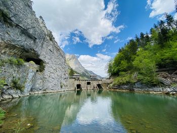 Scenic view of lake and mountains against sky