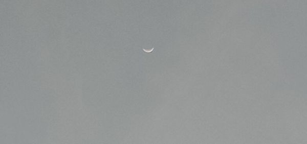 Low angle view of moon against sky at night