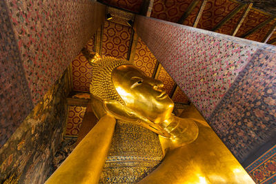 Low angle view of buddha statue at temple