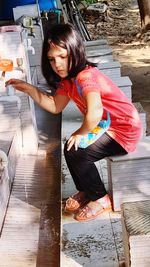 High angle view of woman sitting on floor