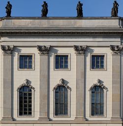 View of classical styled building against clear sky