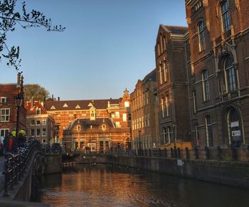 View of buildings in city against clear sky