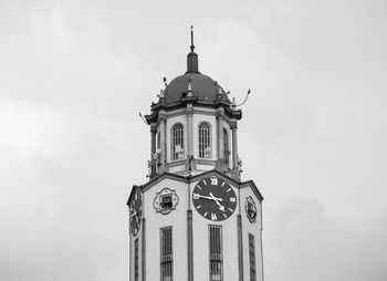 Low angle view of clock tower against sky