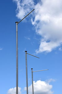 Low angle view of crane against sky