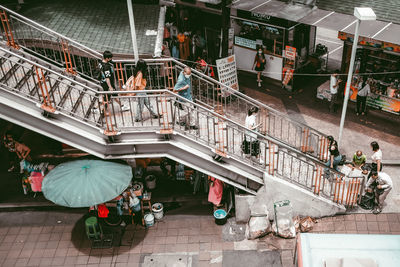 High angle view of people on staircase in city