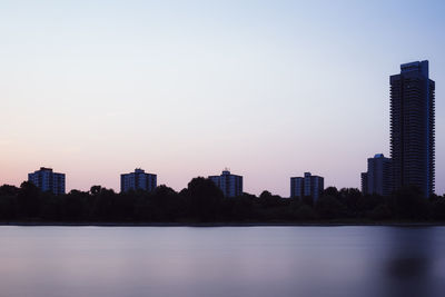 View of cityscape against clear sky during sunset