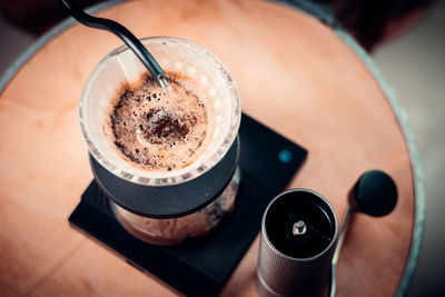 High angle view of coffee cup on table