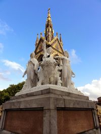 Low angle view of statue against sky