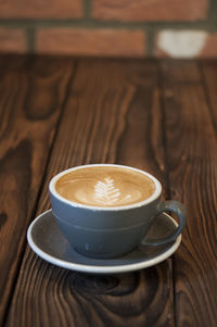 Close-up of cappuccino on table