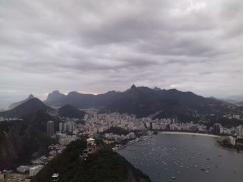 High angle view of buildings and mountains against sky