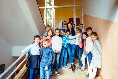 People standing by staircase