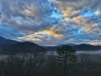 Scenic view of landscape against cloudy sky