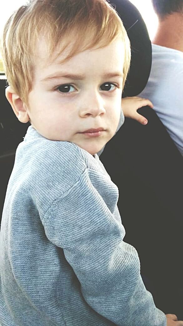 PORTRAIT OF CUTE BOY LOOKING DOWN