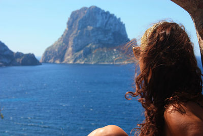 Rear view of woman looking at sea