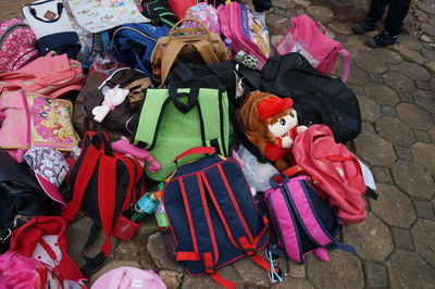 High angle view of bags on footpath 