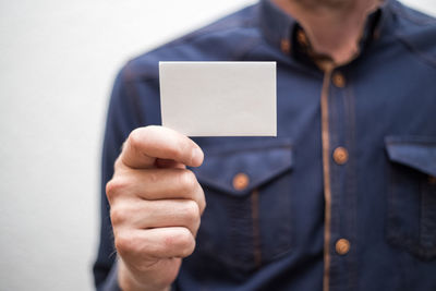 Close-up of man holding camera