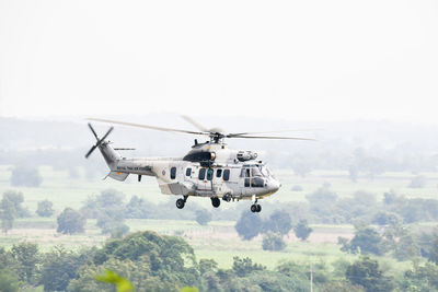 Helicopter flying in sky