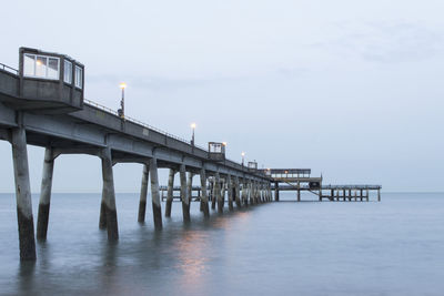 Pier on sea against sky