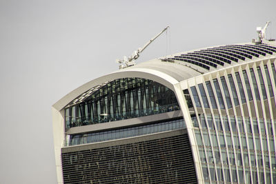 Low angle view of modern building against clear sky