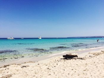 Scenic view of beach against clear sky