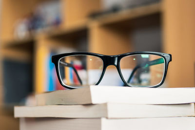 Close-up of eyeglasses on books