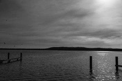 Pier on sea against sky